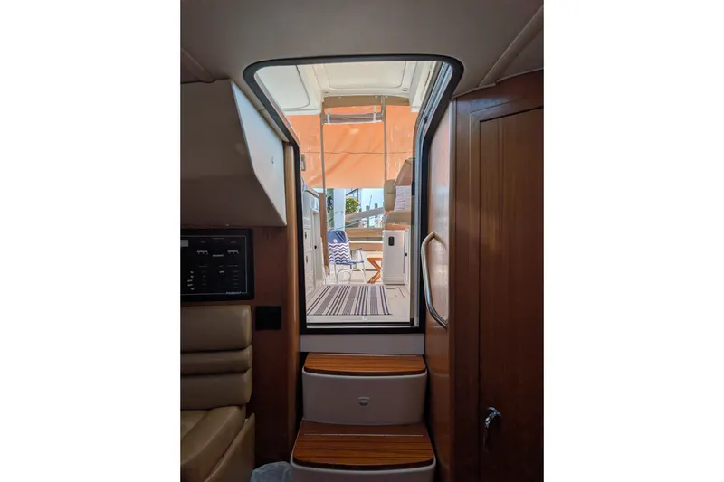 Slide: The Image of Interior view of a 2000 Pursuit 3400 Express yacht, showing steps leading to the deck. - 15