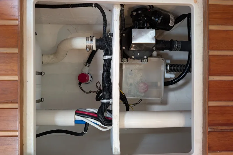 Slide: The Image of Bilge compartment of 2000 Pursuit 3400 Express boat with pump and wiring. - 41