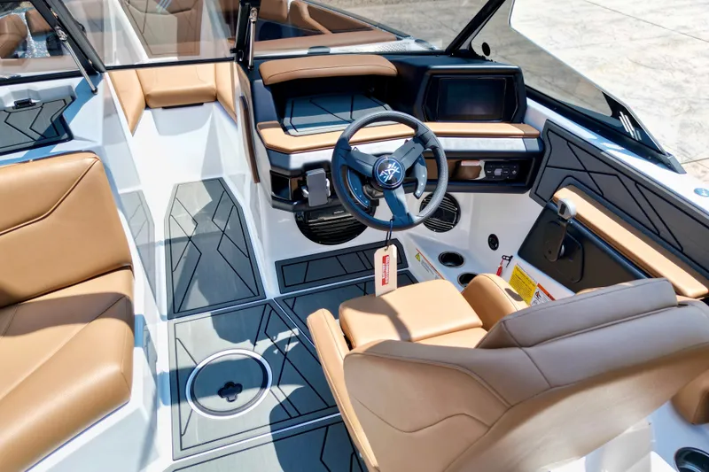 Slide: The Image of Interior of 2027 ATX Surf Boats 22 Type-S with modern dashboard and tan seating. - 14
