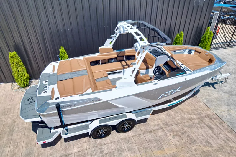 Slide: The Image of 2027 ATX Surf Boats 22 Type-S on trailer, sleek design, brown seating, modern features. - 15