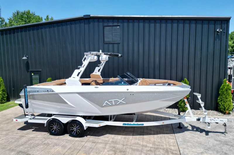 Slide: The Image of 2027 ATX Surf Boats 22 Type-S on trailer, parked outdoors. - 3