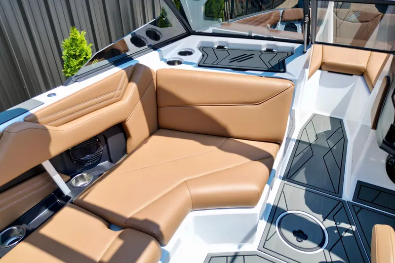 Slide: The Image of 2027 ATX Surf Boats 22 Type-S interior with tan seating and modern design. - 16