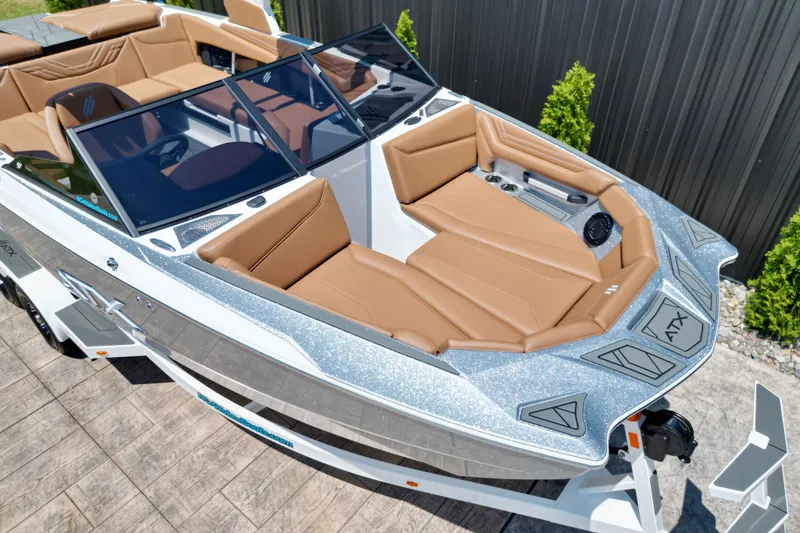 Slide: The Image of 2027 ATX Surf Boats 22 Type-S with sleek design and luxurious tan seating. - 12