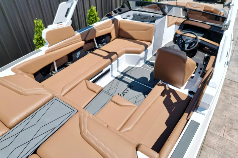 Slide: The Image of 2027 ATX Surf Boats 22 Type-S interior with tan seating and modern dashboard design. - 9