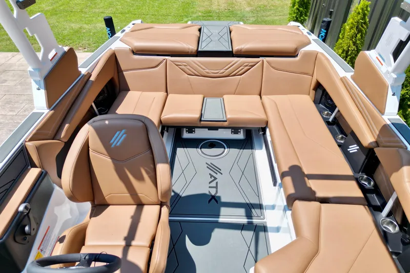 Slide: The Image of 2027 ATX Surf Boats 22 Type-S interior with tan leather seating and modern design. - 11