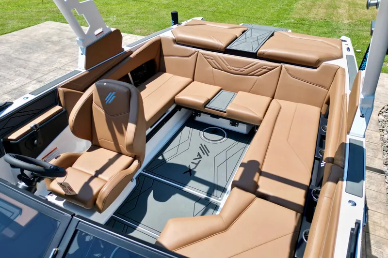 Slide: The Image of 2027 ATX Surf Boats 22 Type-S interior with tan leather seating and modern design. - 10