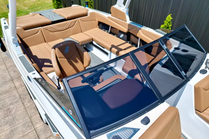 Slide: The Image of 2027 ATX Surf Boats 22 Type-S interior with tan seating and sleek design. - 7
