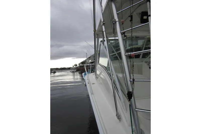 Slide: The Image of 2005 Luhrs 32 Open boat docked on a calm, overcast day. - 22