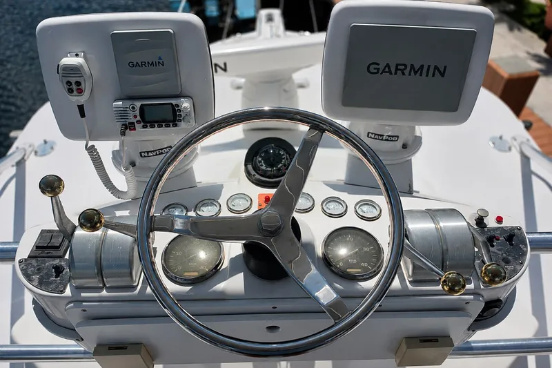 Slide: The Image of Helm of 2005 Luhrs 32 Open boat with Garmin navigation displays and controls. - 41
