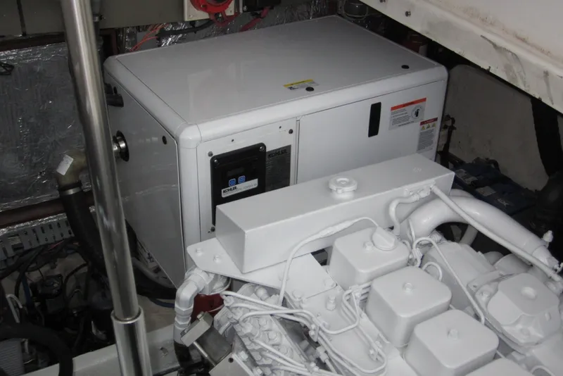 Slide: The Image of Engine room of 2005 Luhrs 32 Open boat featuring a Kohler generator. - 38