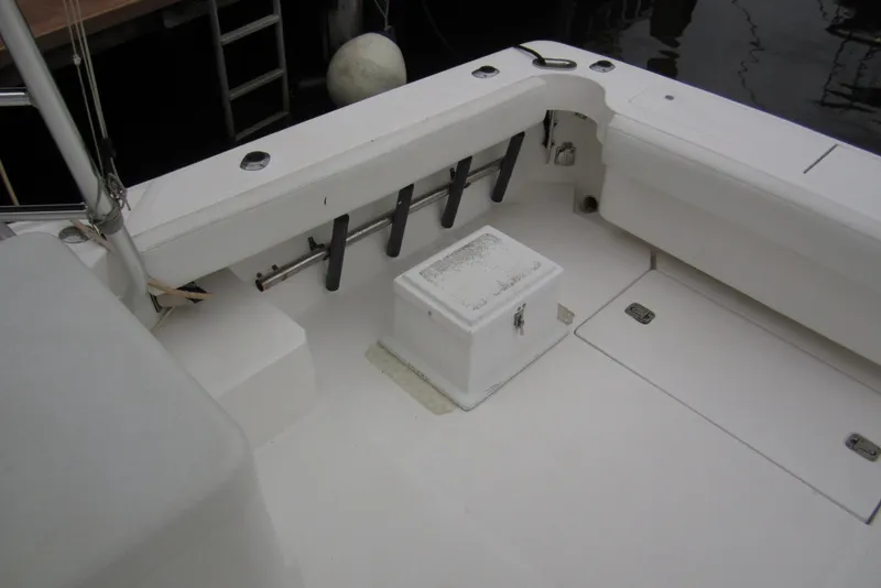 Slide: The Image of 2005 Luhrs 32 Open boat deck with storage and rod holders. - 16