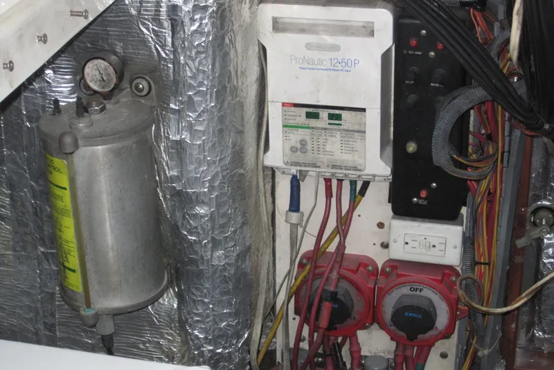 Slide: The Image of Electrical panel and components inside a 2005 Luhrs 32 Open boat engine room. - 39