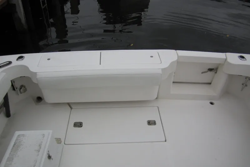 Slide: The Image of 2005 Luhrs 32 Open boat deck with storage compartments and seating. - 17