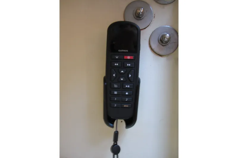 Slide: The Image of Garmin remote control mounted on a 2005 Luhrs 32 Open boat interior. - 33
