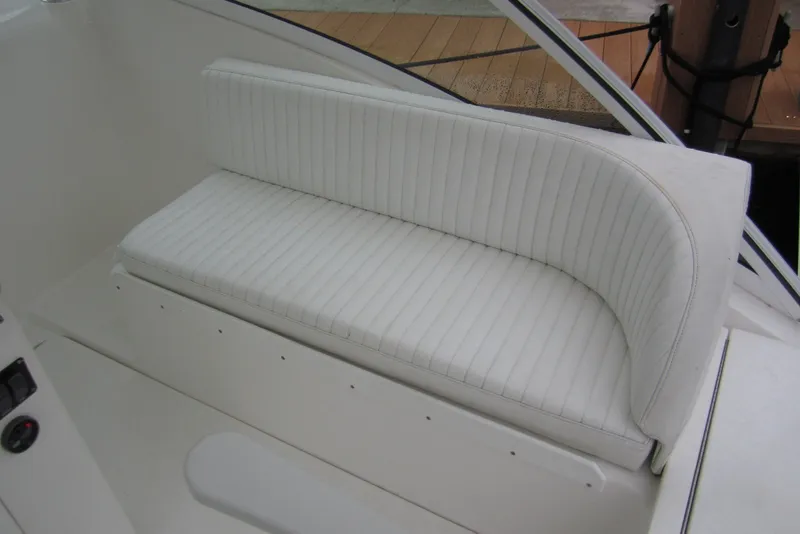 Slide: The Image of White cushioned seating on a 2005 Luhrs 32 Open boat, showcasing sleek design. - 14
