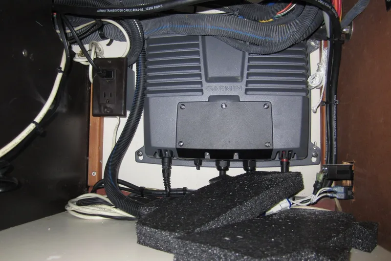Slide: The Image of Electrical setup inside 2005 Luhrs 32 Open boat with Garmin device and wiring. - 32