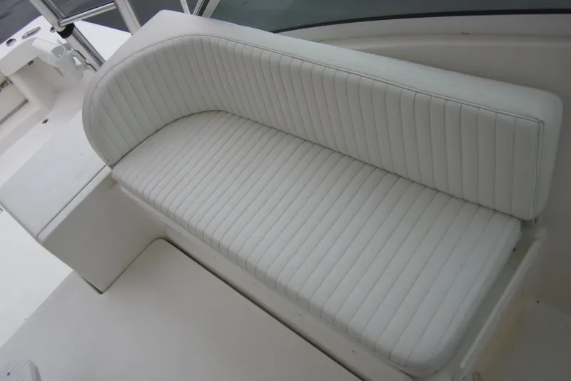 Slide: The Image of White cushioned seating on 2005 Luhrs 32 Open boat deck. - 15