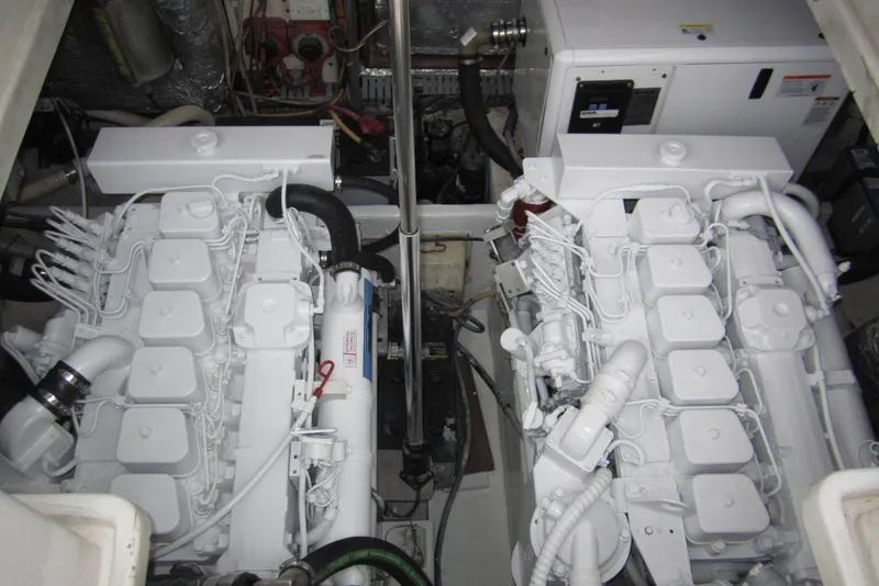 Slide: The Image of Engine room of a 2005 Luhrs 32 Open boat, showcasing dual engines and machinery. - 35