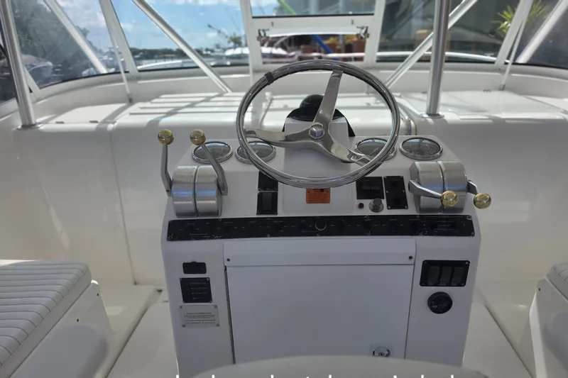 Slide: The Image of Helm of 2005 Luhrs 32 Open boat with steering wheel and controls. - 10