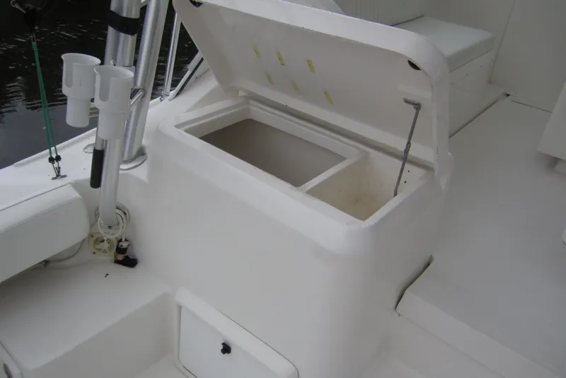 Slide: The Image of 2005 Luhrs 32 Open boat with open storage compartment and rod holders on deck. - 20