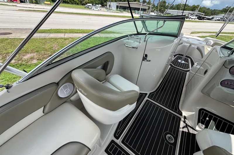 Slide: The Image of Interior view of 2006 Sea Ray 240 Sundeck boat with seating and sleek design. - 57