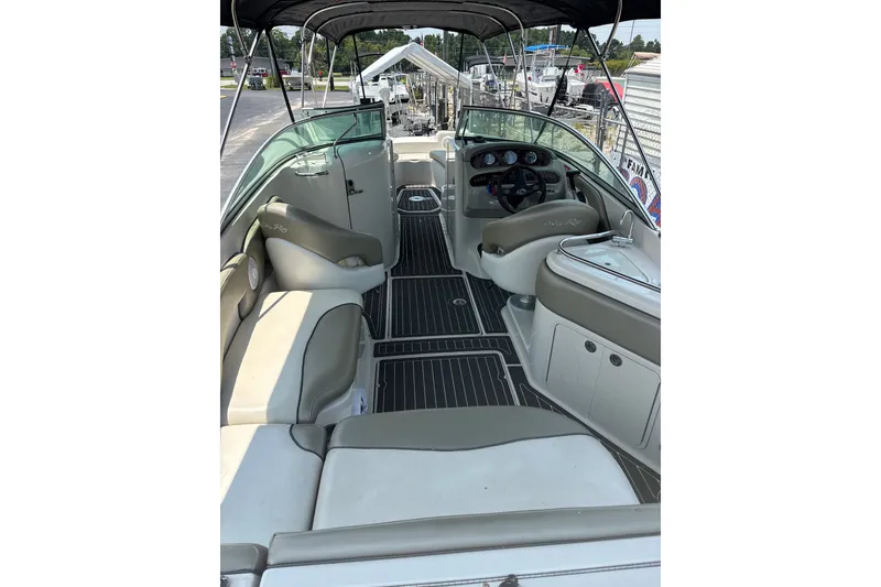 Slide: The Image of Interior view of a 2006 Sea Ray 240 Sundeck boat with seating and helm. - 54