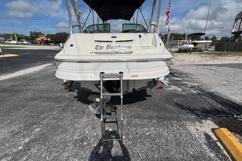 Slide: The Image of Rear view of 2006 Sea Ray 240 Sundeck boat with ladder and propeller. - 31