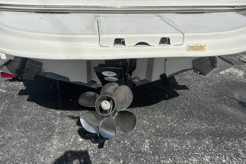 Slide: The Image of Rear view of a 2006 Sea Ray 240 Sundeck boat with propeller and trim tabs. - 30