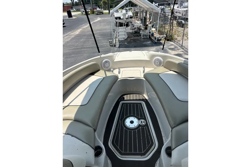 Slide: The Image of 2006 Sea Ray 240 Sundeck interior with seating and deck view. - 22