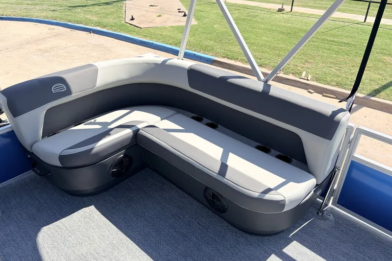 Slide: The Image of 2027 Sun Tracker Party Barge 16 DLX interior seating with cup holders and modern design. - 20