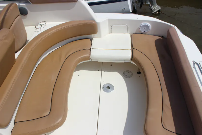 Slide: The Image of 2000 Sea Ray Sundancer 310 boat interior with tan seating and white deck. - 16
