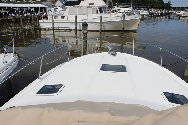 Slide: The Image of 2000 Sea Ray Sundancer 310 docked at marina, view from bow. - 17