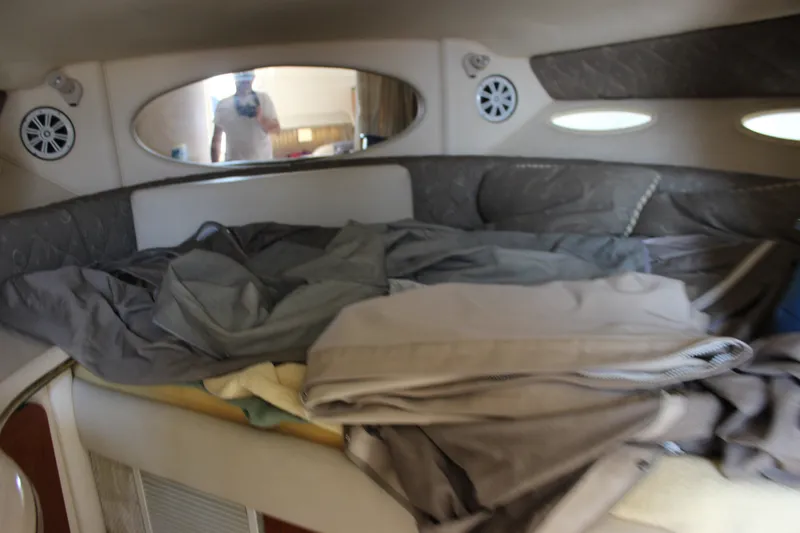 Slide: The Image of Interior cabin of 2000 Sea Ray Sundancer 310 with bedding and mirror. - 21