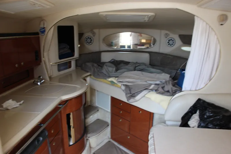 Slide: The Image of Interior of a 2000 Sea Ray Sundancer 310 boat with cozy cabin and kitchenette. - 26