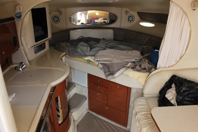 Slide: The Image of Interior cabin of a 2000 Sea Ray Sundancer 310 with bed and kitchenette. - 19
