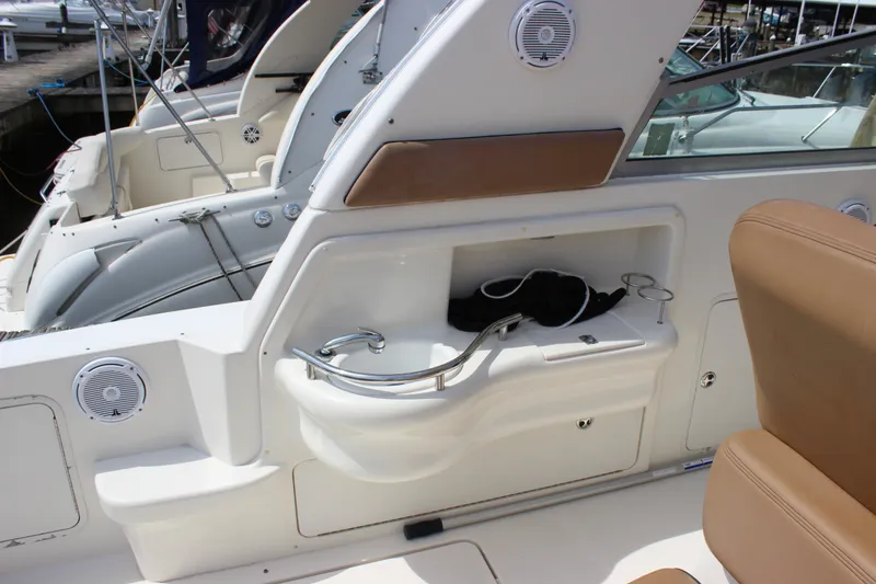 Slide: The Image of 2000 Sea Ray Sundancer 310 boat interior with sink and seating area. - 8