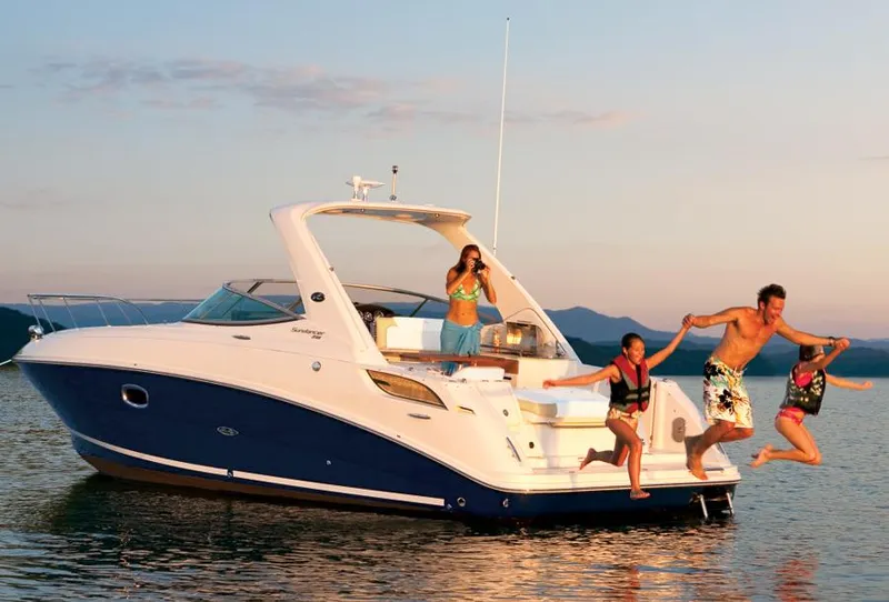 Slide: The Image of Manufacturer Provided Image: Family enjoying a 2012 Sea Ray 310 Sundancer boat on the water. - 32