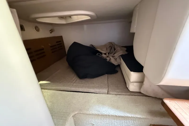 Slide: The Image of Interior cabin of 2012 Sea Ray Sundancer 310 with cozy sleeping area. - 28
