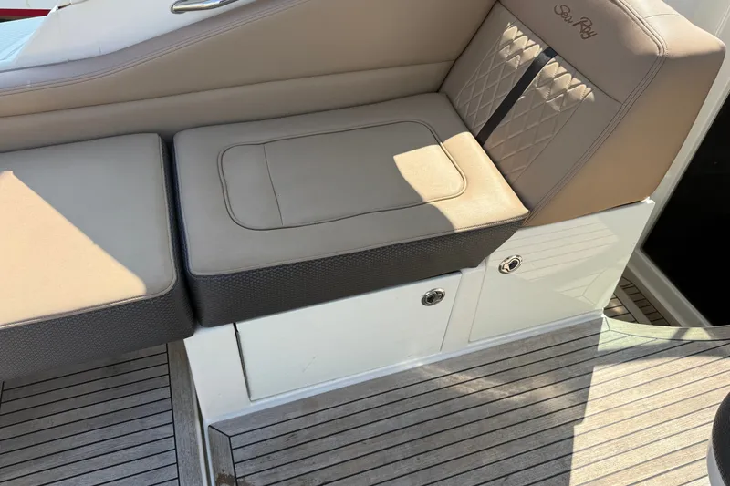 Slide: The Image of 2012 Sea Ray Sundancer 310 boat seating with beige upholstery and diamond stitching. - 15