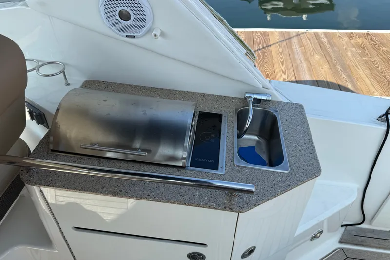 Slide: The Image of Outdoor kitchenette on 2012 Sea Ray Sundancer 310 yacht with grill and sink. - 13