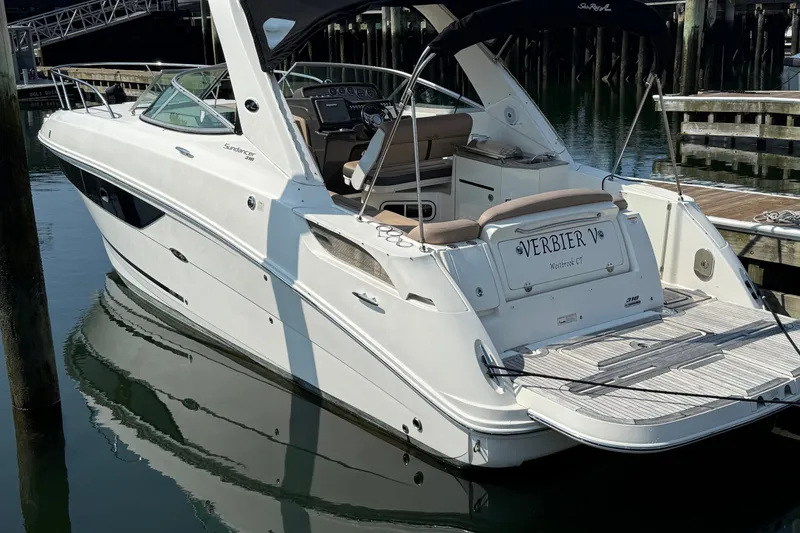 The Image of 2012 Sea Ray Sundancer 310 yacht docked at marina, rear view. - 1
