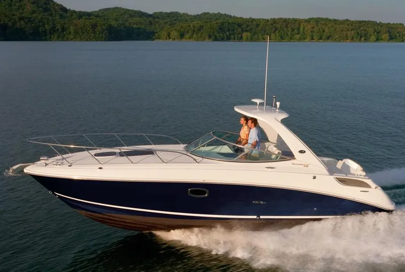 Slide: The Image of Manufacturer Provided Image: 2012 Sea Ray 310 Sundancer cruising on a serene lake. - 3