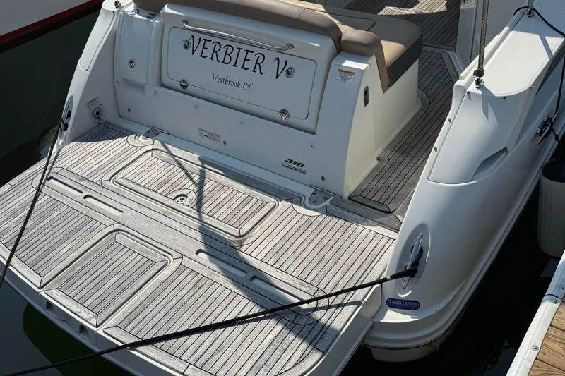 Slide: The Image of 2012 Sea Ray Sundancer 310 boat with teak deck, docked at marina. - 4