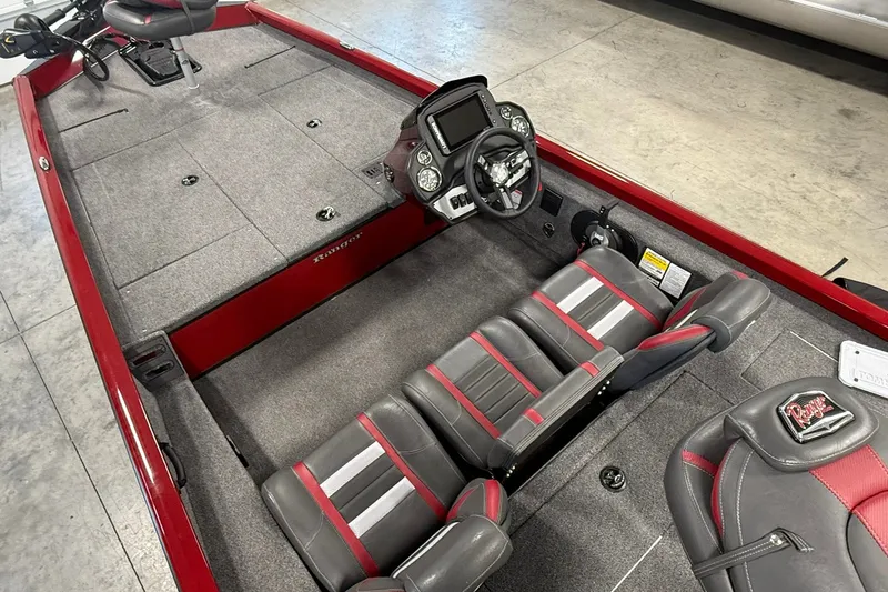 Slide: The Image of 2021 Ranger RT188 boat interior with gray and red seating, steering console, and carpeted deck. - 18