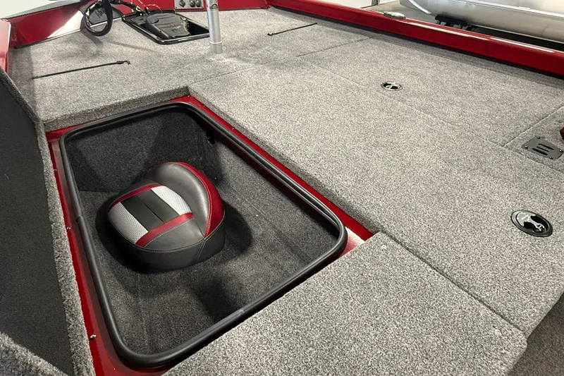 Slide: The Image of 2021 Ranger RT188 boat interior with storage compartment and cushioned seat. - 15