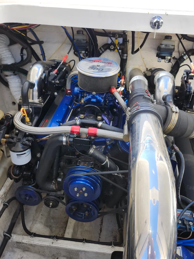 Slide: The Image of The engine compartment of a 1999 Fountain 42 Lightning with a powerful engine and shiny components. - 0