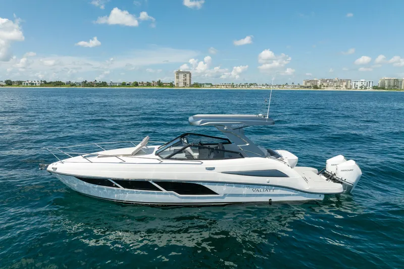 Slide: The Image of 2025 Valiatt 350GT luxury boat cruising on open water under a clear sky. - 2