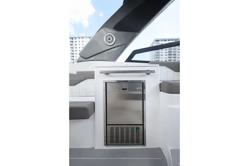 Slide: The Image of Valiatt 350GT 2025 boat interior with stainless steel refrigerator and modern seating. - 13