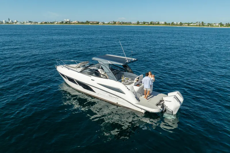 Slide: The Image of 2025 Valiatt 350GT luxury boat cruising on open water with passengers. - 0
