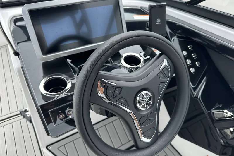 Slide: The Image of 2025 Yamaha Boats 252SD steering wheel and dashboard with touchscreen display. - 22